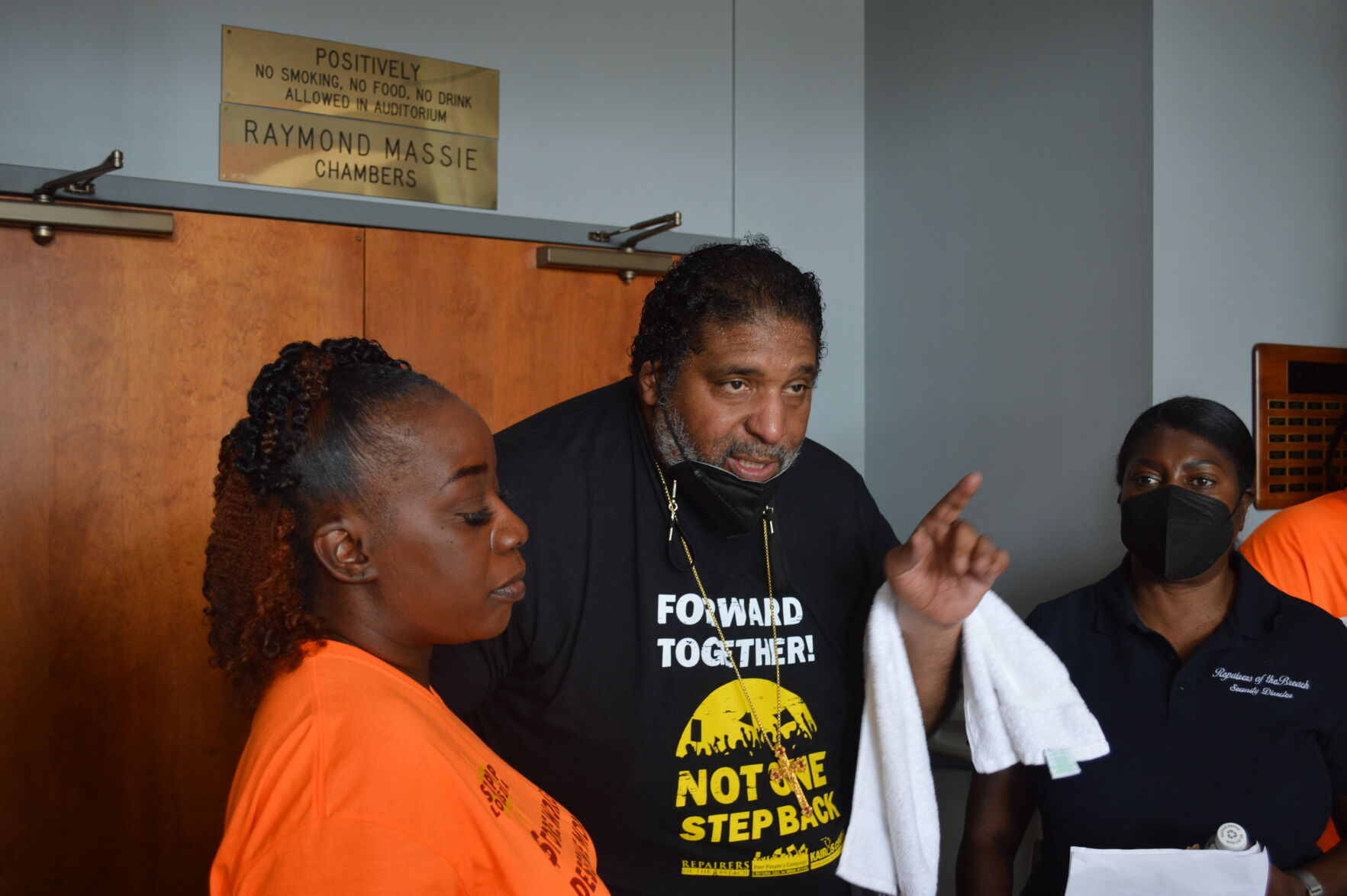 William Barber II addresses demonstrators at Dollar General corporate headquarters